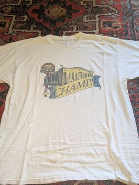Champs White Short Sleeve Tee with Yellow & Blue Graphic